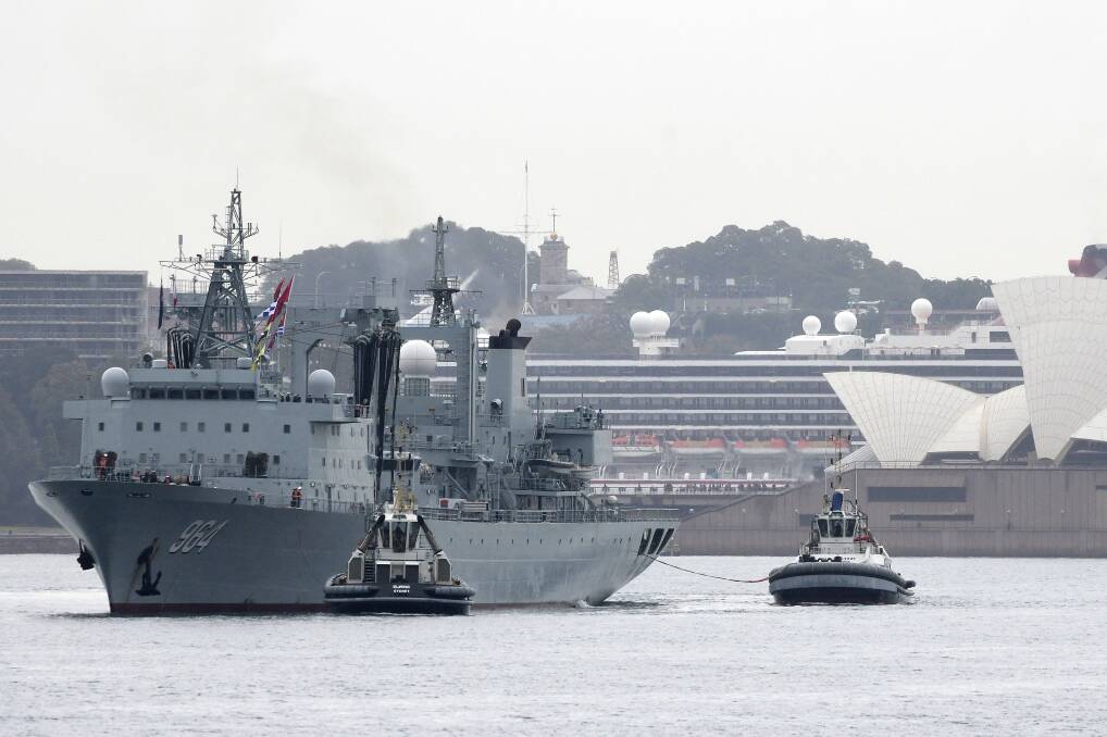 Surprise visit: A Chinese naval ship departs Sydney Harbour on Friday, June 7. Three Chinese navy ships made the unannounced four-day visit to Sydney. Photo: AAP
