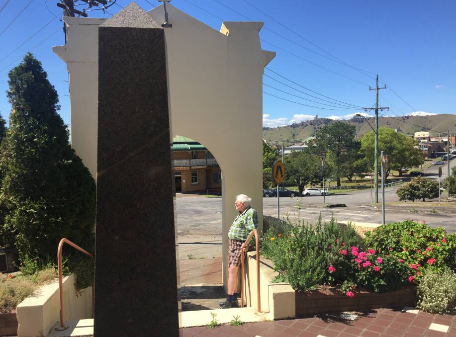 Trevor Brooker at the memorial, with the town of Dungog in the background. 