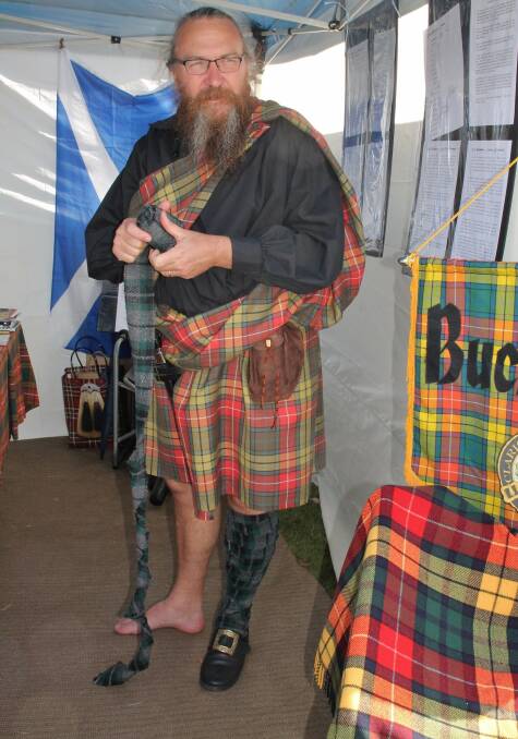 Member of Clan Buchanan, Stephen from the Central Coast, rolling up his puttee (a puttee is a strip of cloth wound spirally round the leg like a bandage and serving as a gaiter) at the Wingham’s Bonnie Scottish Festival.