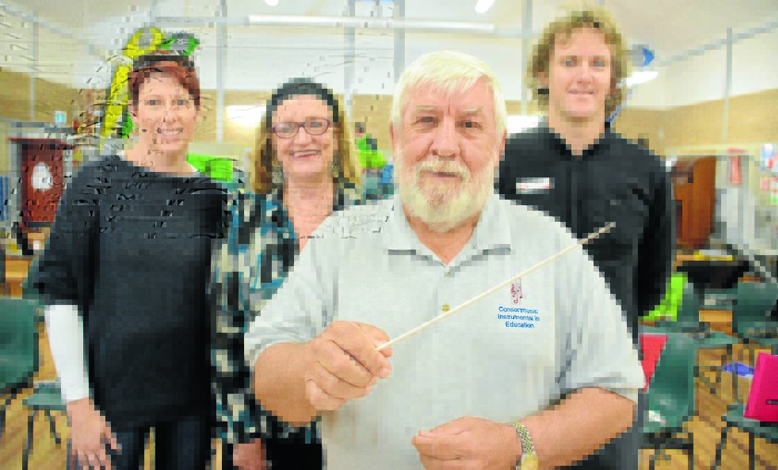 Roger Griffith with Tanya Brown of Bass'n'Blues, Alison Ross from Pacific Palms Public School, and Jacob Cook of Taree West Public School.