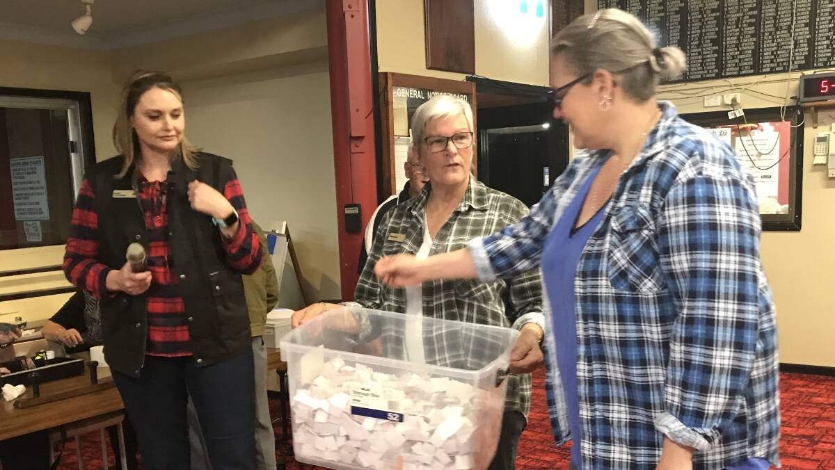 CBA branch manager Jaimie Mathiske, Maureen Koppen and Ruth Lovell drawing the raffle at Wingham Bowling Club. Picture: submitted