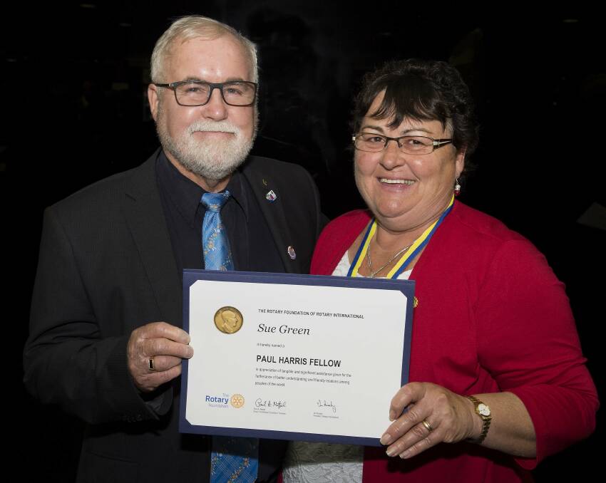 Paul Harris Fellow: Sue Green with Rotary Club of Taree past president David Dennig at the club changeover dinner earlier this year. Photo: Ashley Cleaver Images