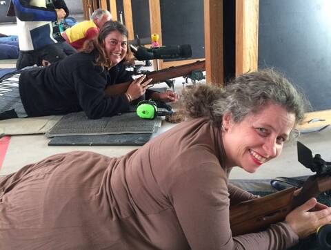 Merry Christmas: Rhonda Cassar (foreground) and Sharron Ashby from the Forster-Tuncurry & Wingham Small Bore Rifle Club preparing to shoot in the Christmas shoot for the club.