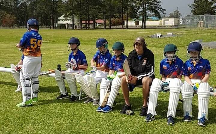 The Wingham under 12s team waiting to bat at Bulahdelah. Photo: supplied