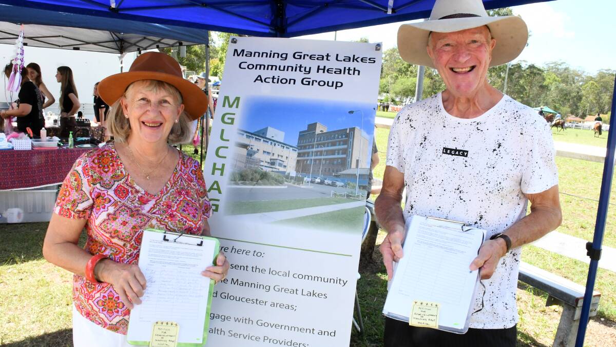Trish and Eddie Wood collecting signatures for the petition at Nabiac Show. Picture by Scott Calvin.