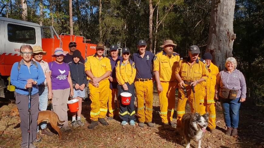 Ready to walk: Members of the Wherrol Flat Rural Fire Service brigade and the community prior to starting the walkathon. Photo: supplied