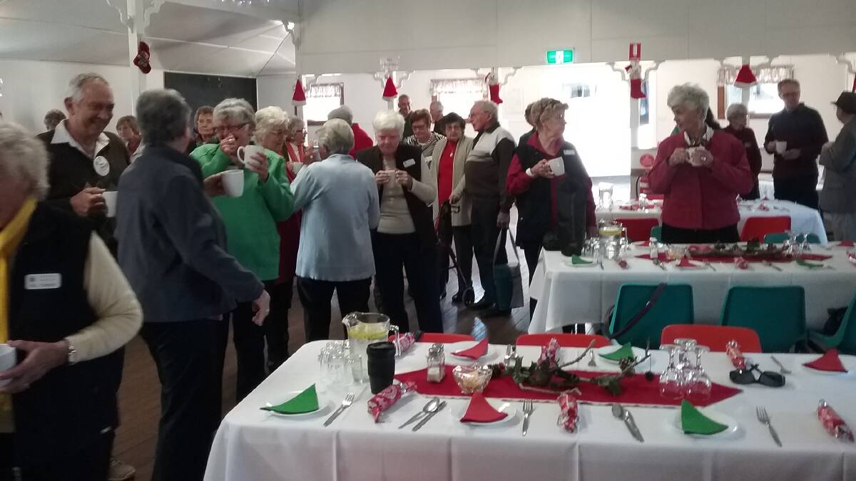 Christmas in July: Probus members enjoying a cuppa on arrival at Marlee Hall. Photo: supplied