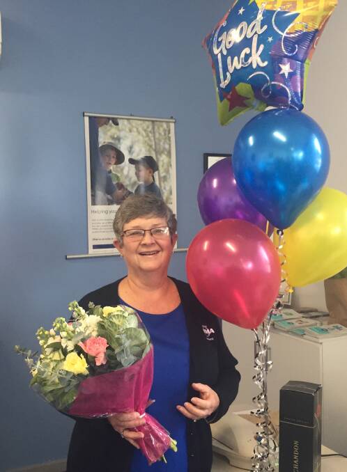 Anne was presented with flowers, balloons and a bottle of Moet & Chandon on her last day. Her retirement present was gifted to her the day before. Photo: Julia Driscoll