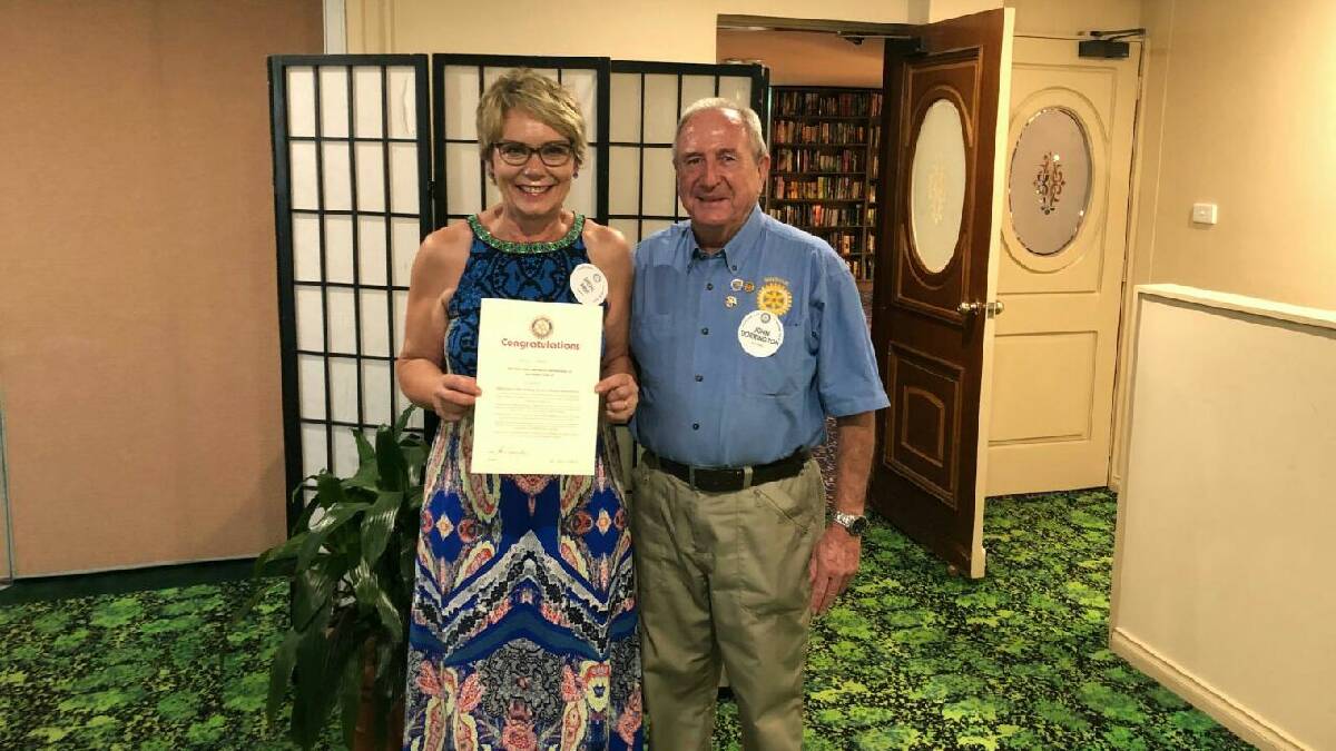 Fully fledged member: Sheryl Amos was inducted by Wingham Rotary Club president John Dorrington. Photo: supplied