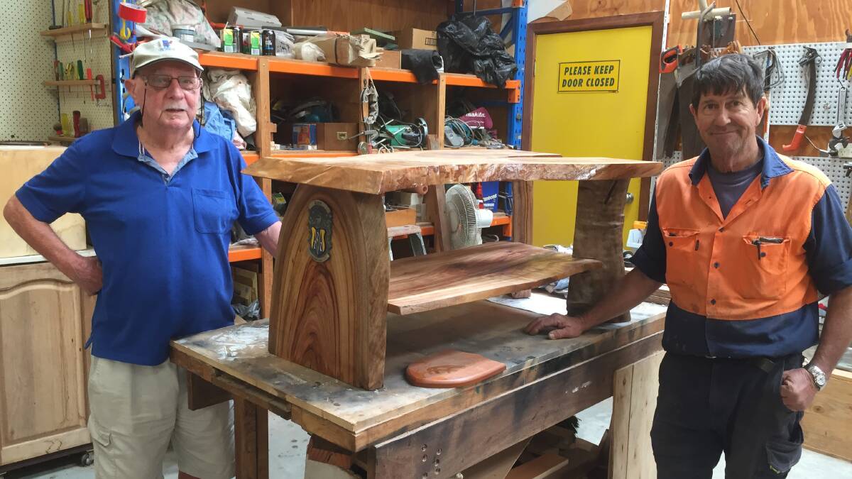 Tony Baker (left) and Bud Olejniczak with the coffee table Bud completed for Tony. Photo: Julia Driscoll