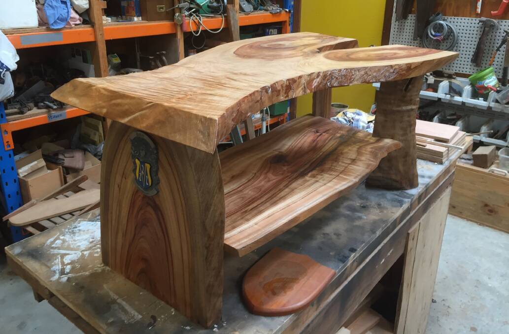 Completed coffee table: The top was a slab of what Tony thought was English elm, while Bud constructed the rest from camphor laurel. The family crest is shown on the leg. Photo: Julia Driscoll