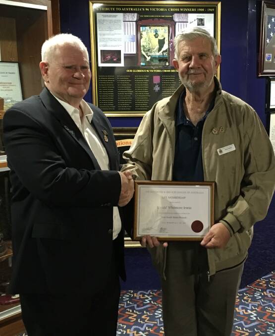 NSW RSL state councillor Ray James presenting Wingham RSL sub-branch member Ron Irwin with his life membership. Photo: supplied