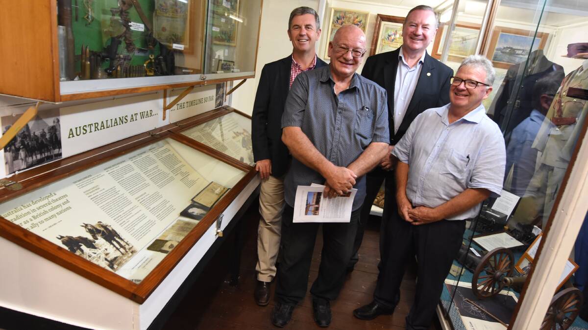 Wingham Museum curator Terry Tournoff, Manning Valley Historical Society Neal Greenaway, Member for Lyne Dr David Gillespie and Member for Myall Lakes Stephen Bromhead in front of the new war display. Photo: Scott Calvin