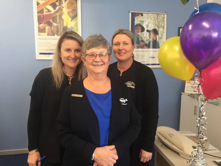 Retiring: Anne Anlezark (centre) flanked by coworkers Rebecca Dawson and Chantel Ferris. Between the three they have given 81 years of work to Manning Smash and Auto Repairs/NRMA Service Centre. Photo: Julia Driscoll