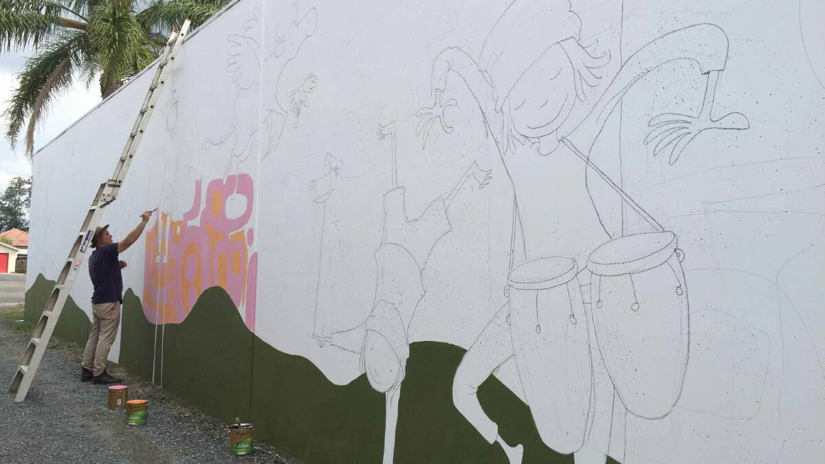Colouring the town mural by mural | photos and video