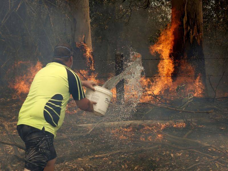 Jamie Fato battled the odds to tame an out of control fire Koorainghat, near Taree.