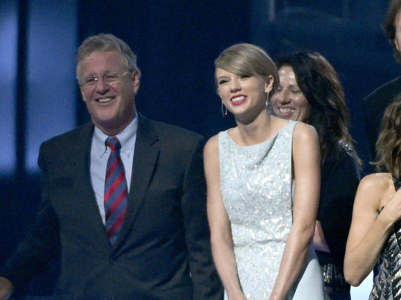 Taylor Swift's father Scott has fought off a burgler who broke into his Florida penthouse.