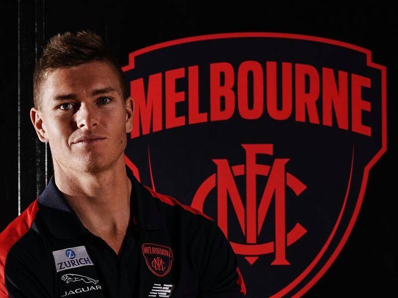 Adam Tomlinson says the opportunity to play more regularly in one position drew him to the Demons.