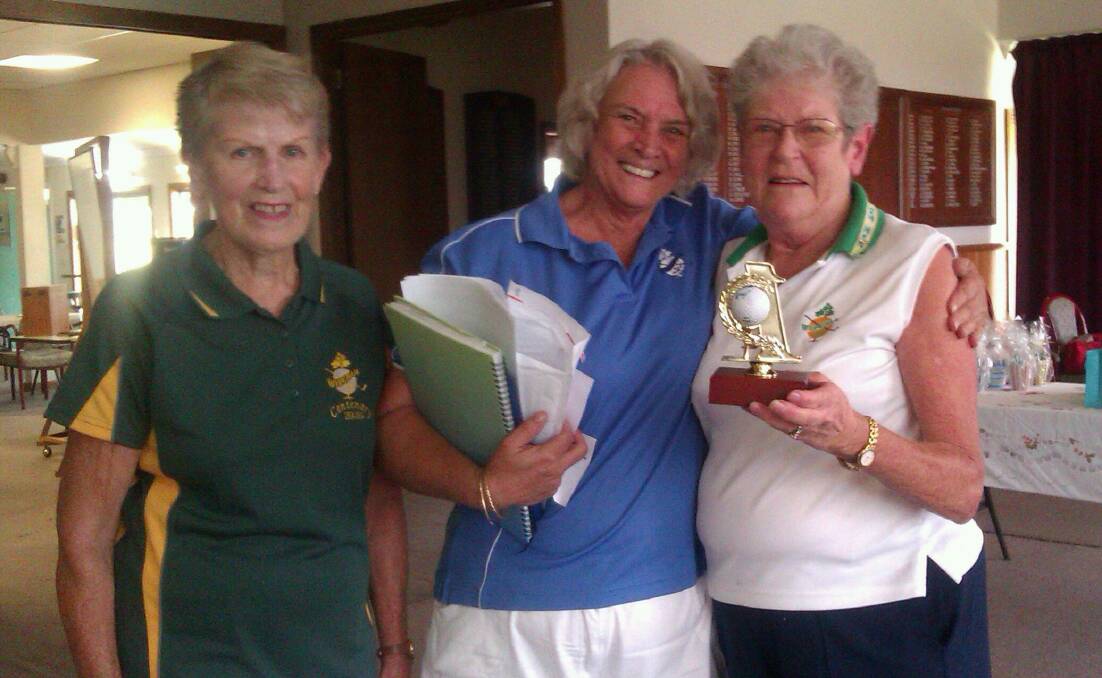 Jan Baker, Beth Braham and Joy White with her hole-in-one trophy