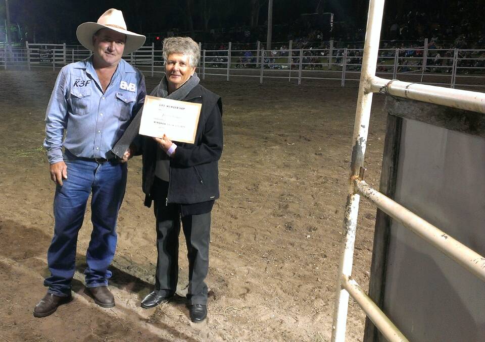Merv Mills of the Wingham Show Society with Kate Fraser who accepts Life Membership on behalf of her son Jim.