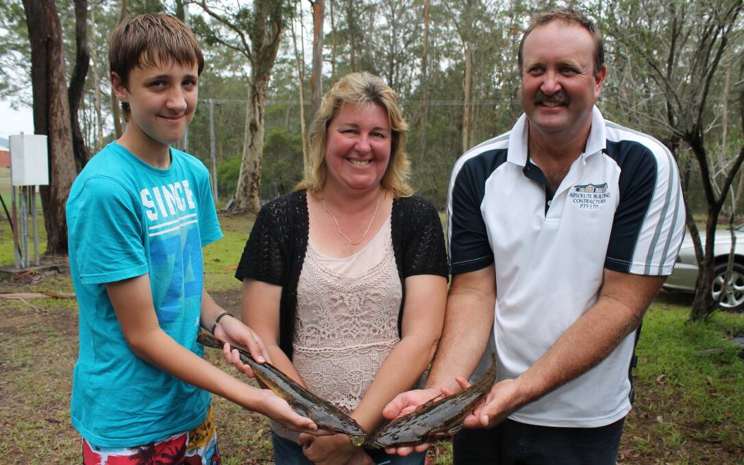New members of Wingham Services Bluewater Fishing Club show off their flathead; Thomas, mum Belinda and dad Rodney Moore