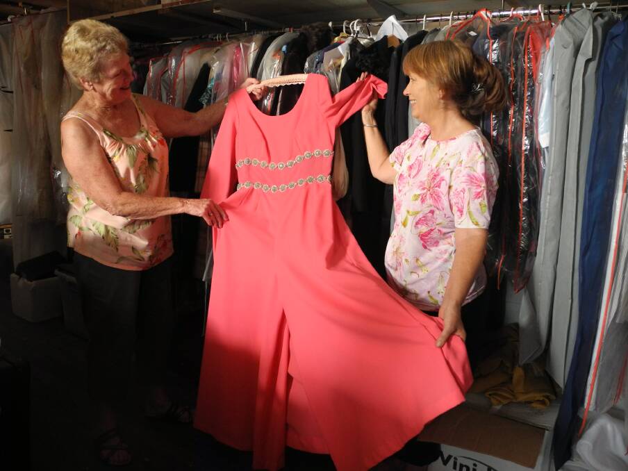 Barbara Waters and Kim Armstrong at Wingham Museum look at a pair of culottes from the 1970's or 1980's. They are part of the Moore collection to be showcased at the fashion show.