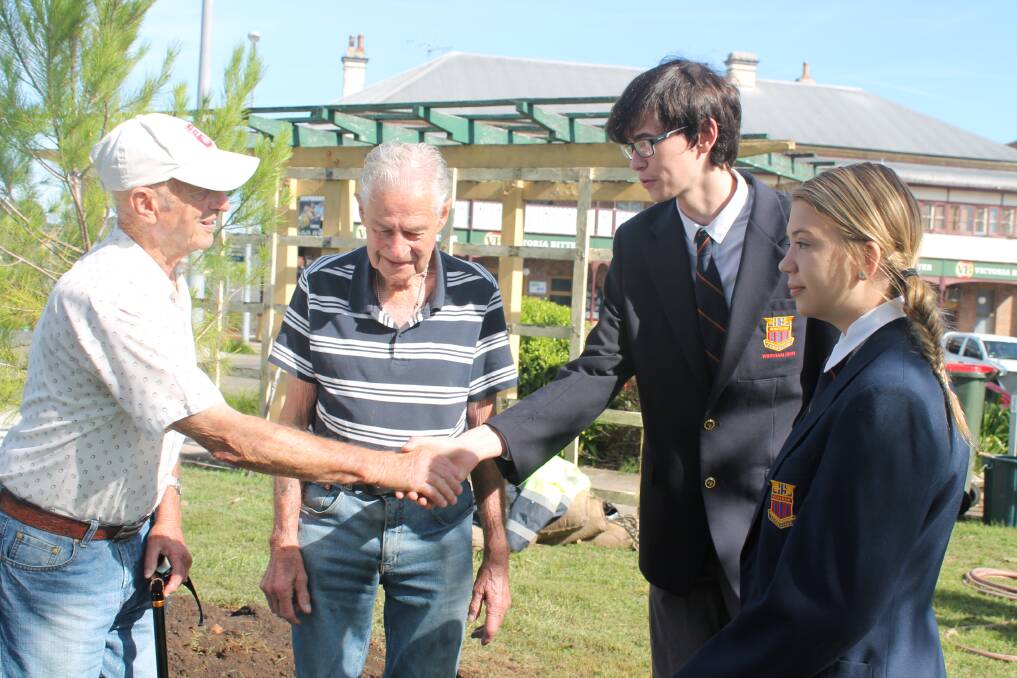 World War II veterans Guy Watts and Allan Carlyle, from Wingham RSL sub branch meet Wingham High Year 11 Modern History students Darcy Byrne and Amber Hawkins, at the planting of the new 'Lone Pine.'