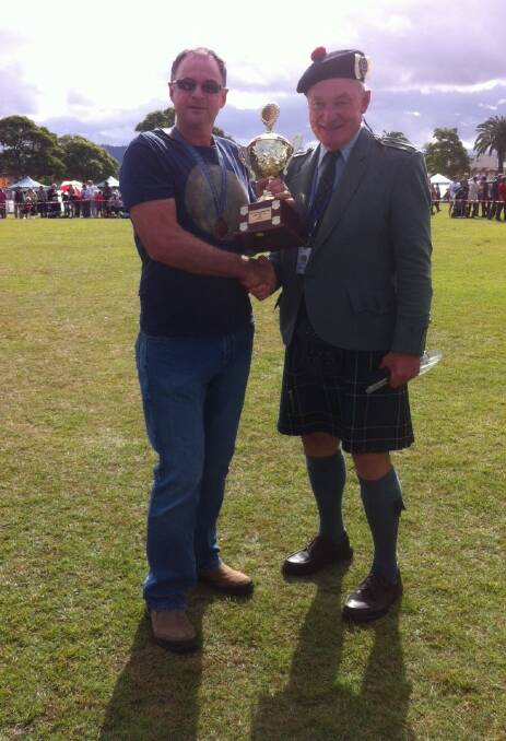 Caber Toss champ Stephen Brown with Wade King at the 2014 Bonnie Wingham Scottish Festival.