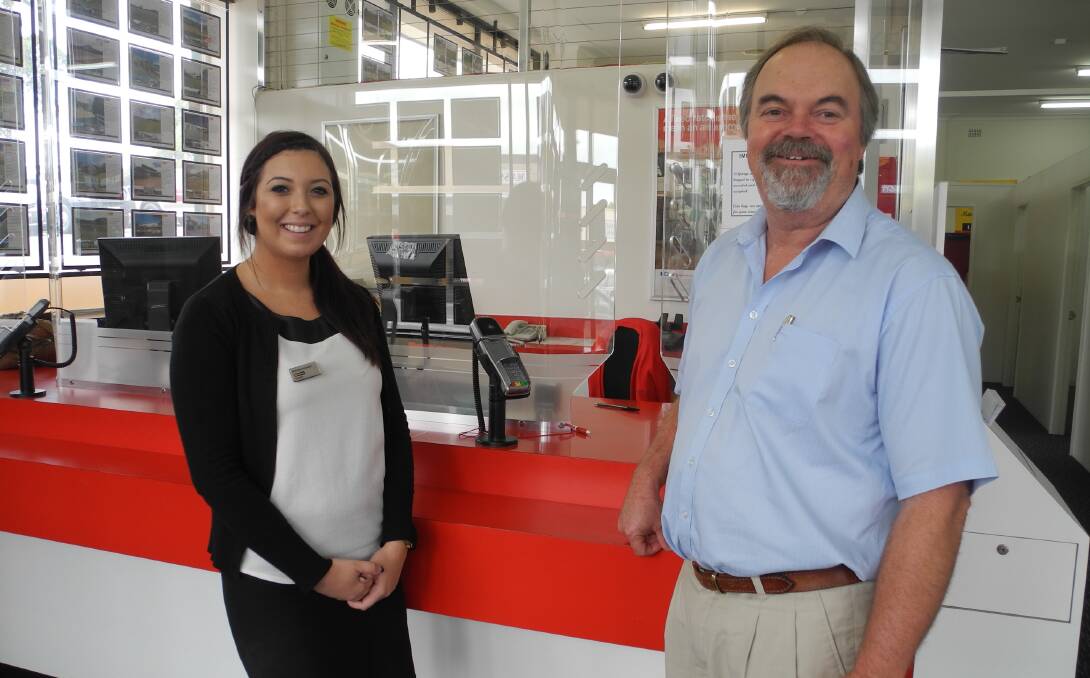 LJ Hooker licensee Tim Bale and Brittany Pulvirenti at the soon to be closed St George bragency in Wingham.