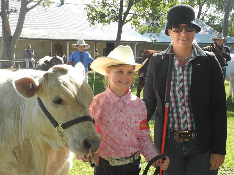 Eight year old Jessica Cassels from Tinonee Public School wins second place in heat one of the 'pee wee' under 13 parading at Beef Week 2014