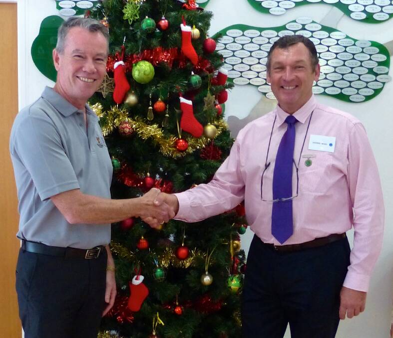 Ross Bingham, CEO Ronald McDonald House Northern NSW congratulating George Hoad.
