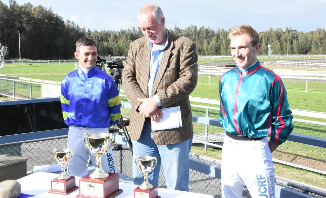  Well done: Corey Brown presents Ben Looker with his trophy after his win on Blinkin Artie in the Corey Brown Cup.
