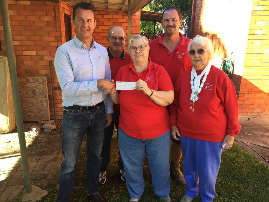 Manning support group volunteers Allan Reeves, Betty Mayers, Rodney Cribbin and Audrey Reeves with Westpac Rescue Helicopter regional marketing manager Chad Griffith in 2017. 
