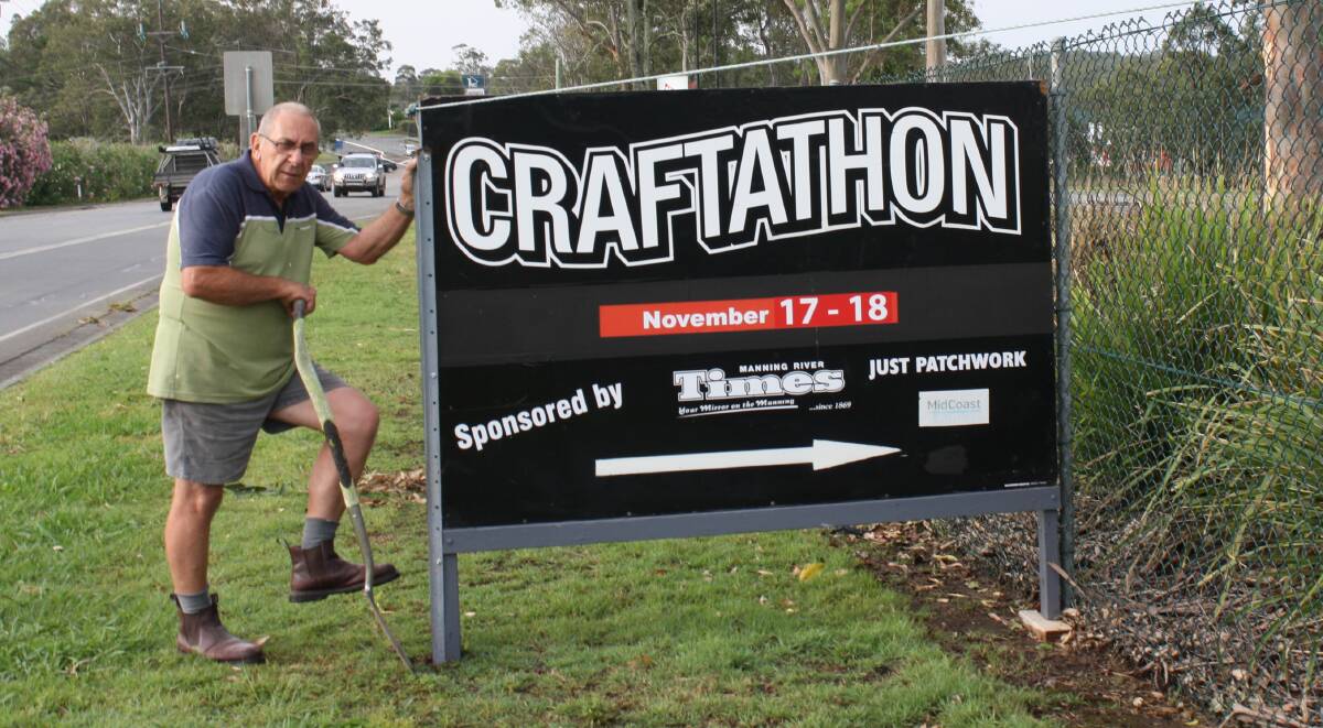 Allan Eyb works to install a sign outside of Club Taree on Wingham Road to promote the location of the 2018 Craftathon. Stalls and craft displays will be set up in the auditorium, and it will be the final year of the event.