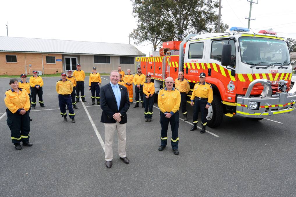 Member for Myall Lakes Stephen Bromhead and Rural Fire Service Mid Coast district manager Kam Baker with the Tinonee RFS crew. Photo: Scott Calvin.