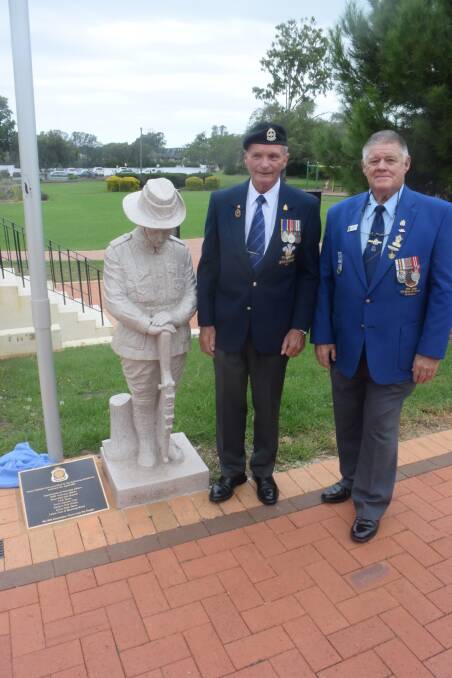 Contributions: Former Taree RSL sub-branch president Darcy Elbourne and current president Charles Fisher at the unveiling of the plaque at the Taree War Memorial. Photo: Rob Douglas.