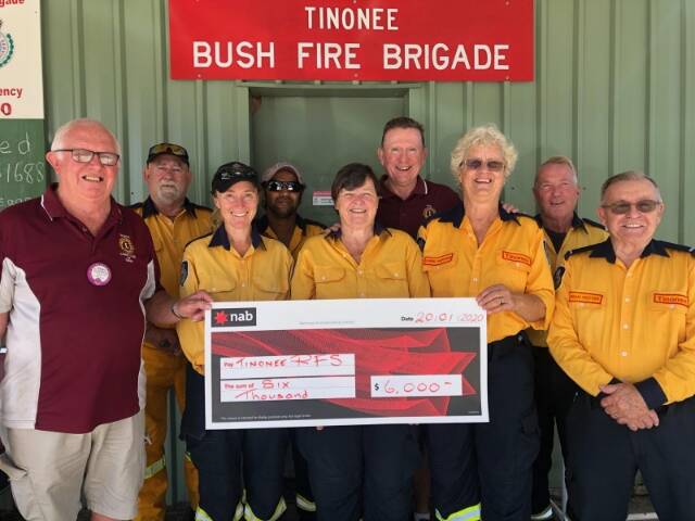 Happy faces: Taree Lions Club's George Greaves and Phil Grisold presented the donation to Tinonee Rural Fire Service. Photo: supplied.