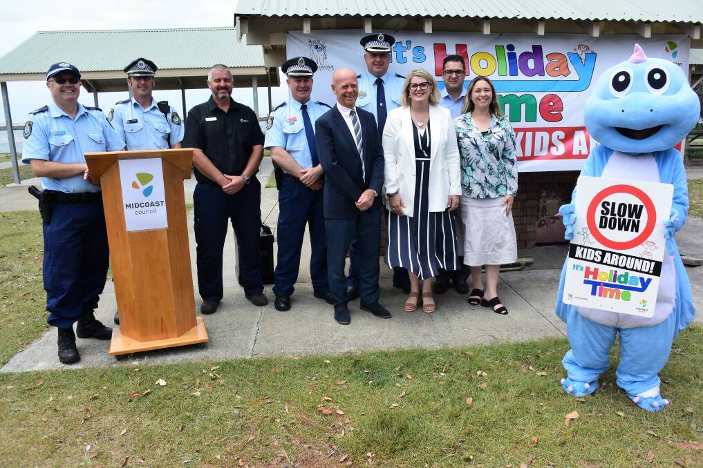 Great safety message: Representatives from the Little Blue Dinosaur Foundation, MidCoast Council and Manning Great Lakes Police District at the launch of the signage campaign. Photo: Rob Douglas.