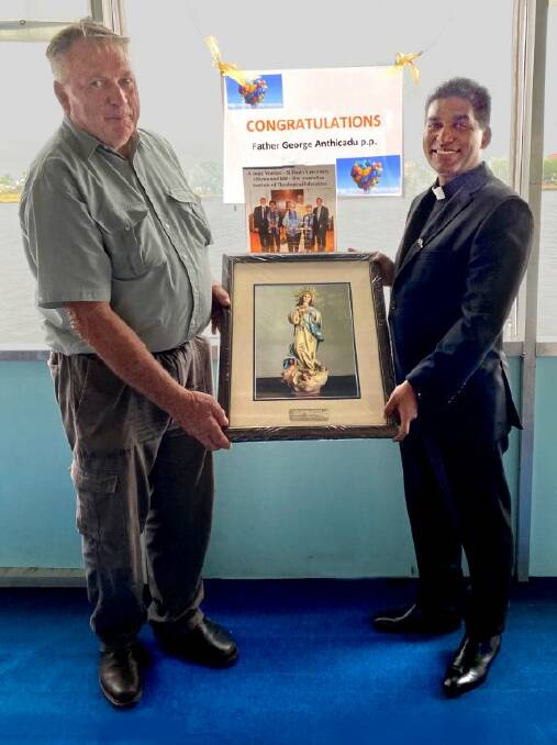 Peter Neal presented Fr George with the framed painting.