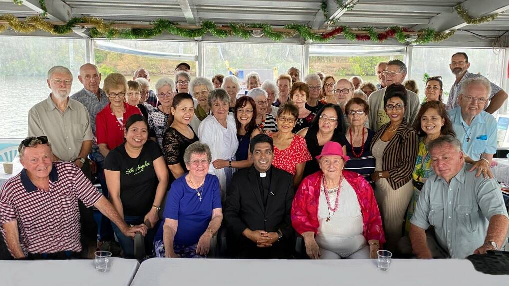 Fr George Anthicad was surprised by a cruise on the Manning River with parishioners. Photo: supplied.