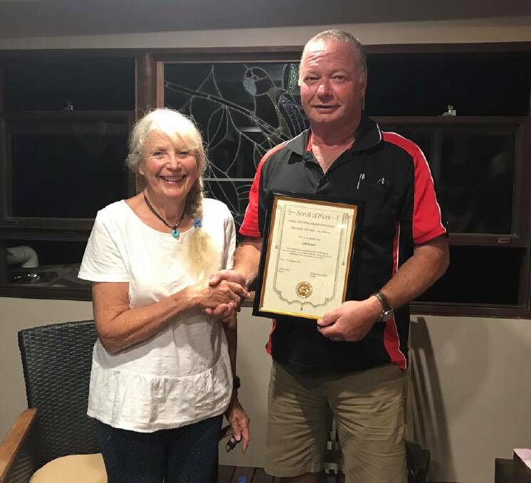 Jan Wade accepted her award from zone six president Ralph Turnbull. 