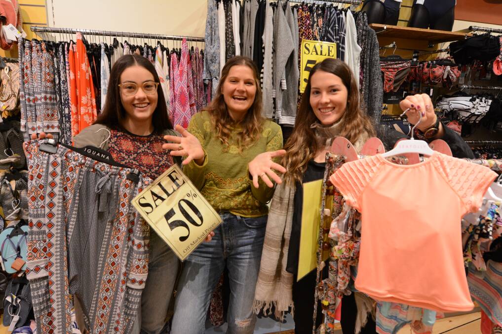 Prices slashed: Chelsea and Claudia Yarad, along with Ashleigh Kelly at Iguana Forster during last year's Crazy Day event. Participating retailers will open early and continue trading throughout the day. 