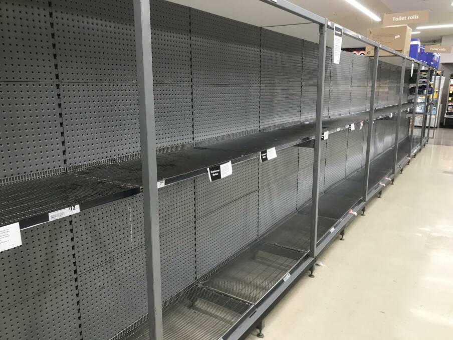 Nothing left: Taree shoppers wiped out shelves of toilet paper in Woolworths earlier this week. Some people believe the coronavirus will cause toilet paper shortages nationwide.