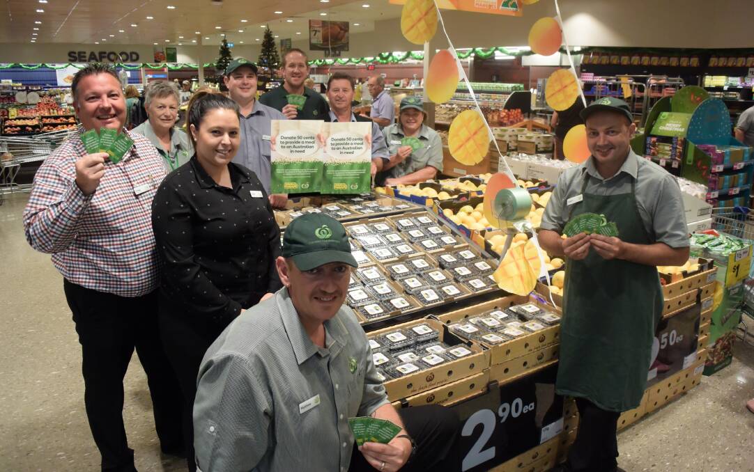 Helping the hungry: Woolworths' Craig Feuz, Lorraine Lowe, Amie Walker, Luke Williams, Matthew Cloak, Phil Lohse, Beau Blanch, Toni Ericson and Adam Abbott launched the appeal at the Taree store. Photo: Rob Douglas.