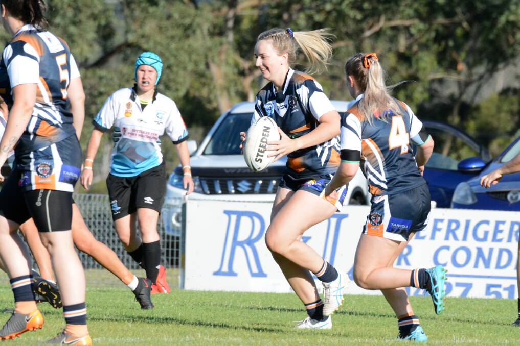 Brooke Atkins takers a hit-up for Wingham Tigers in the North Coast 11-a-side competition last year.