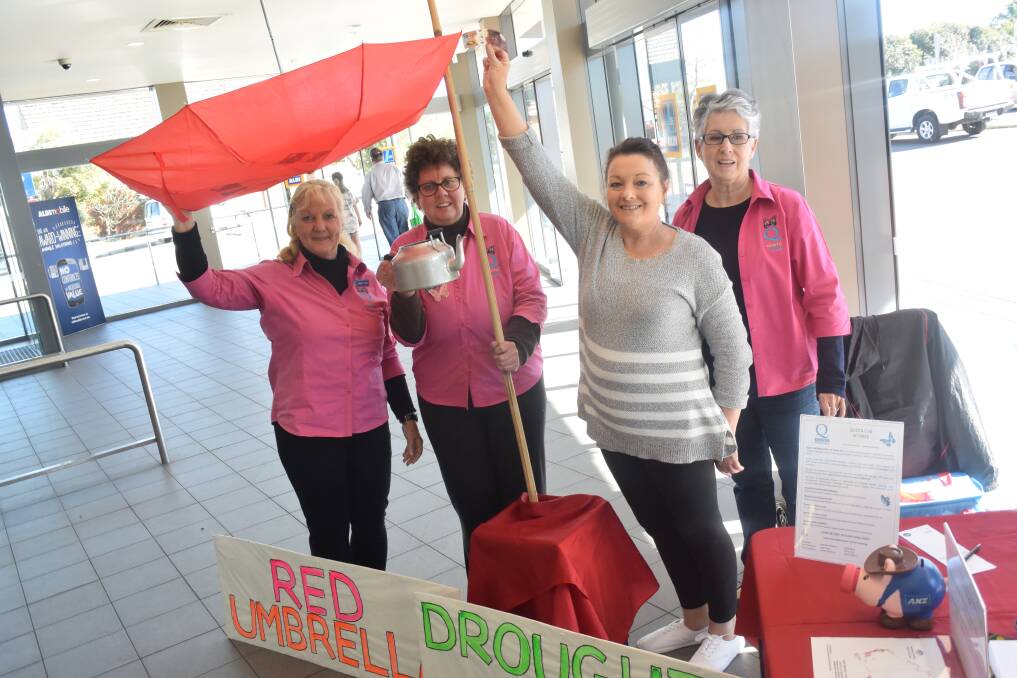 Support for farming families: Taree Quota's Debbie Steber, Romany Low and Janenne Towers accept a donation from Paula Booth (front) at Aldi Taree. Photo: Rob Douglas. 