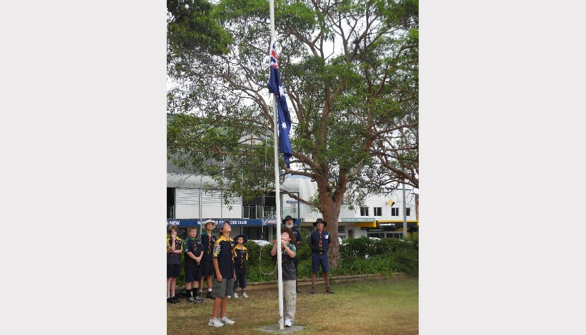 The Scouts raised the flag to begin the official ceremony