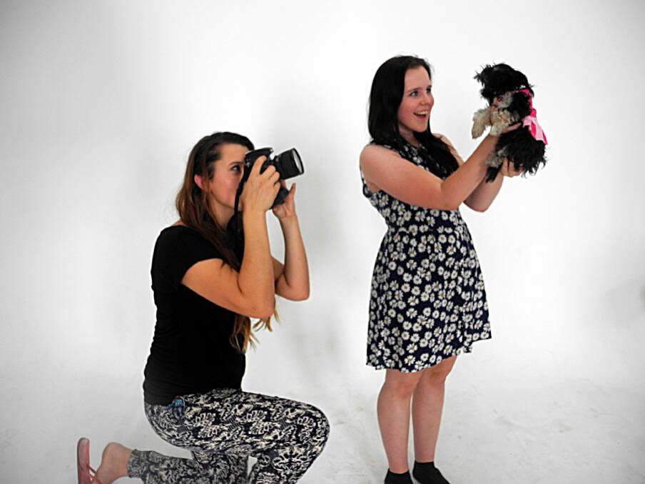 Elli Reinhardt and Madelyn McKay enjoy working experience at MR Photography with puppy Mia