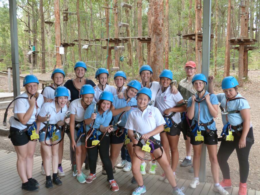 Teamwork: The Wingham High students were put through their paces at the Tree Top Adventure Park in Newcastle.