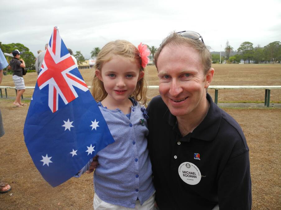 Young Arabella Roohan waves the flag for Rotary